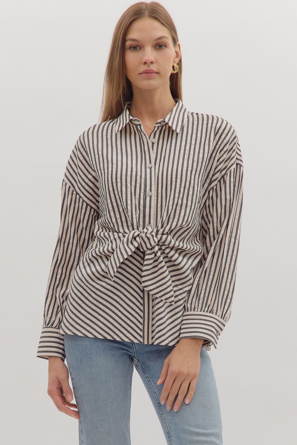 Striped long sleeve button-down top featuring front self-tie detail