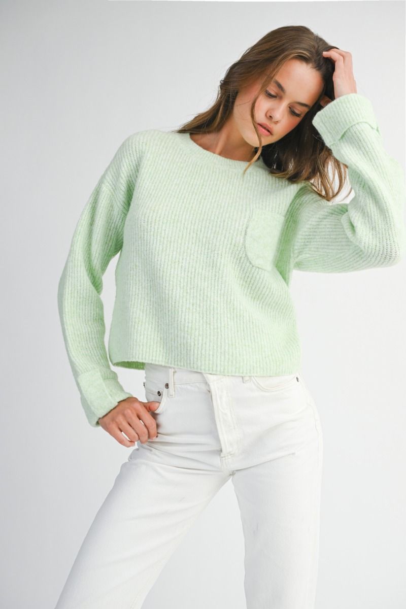 Solid crew neckline long sleeve with fold cuff detail knit pullover sweater top.